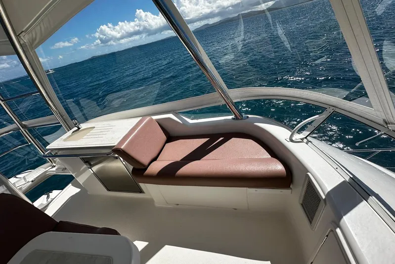  Yacht Photos Pics 2012 Riviera 43 Flybridge yacht interior with ocean view and comfortable seating.
