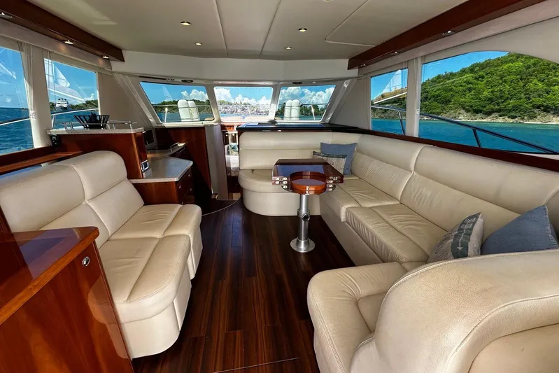  Yacht Photos Pics Luxurious interior of 2012 Riviera 43 Flybridge yacht with leather seating and ocean view.