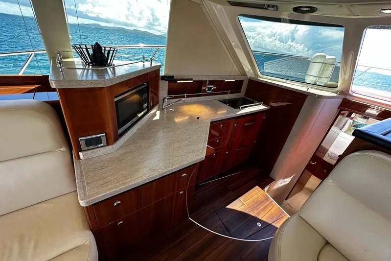  Yacht Photos Pics Luxurious 2012 Riviera 43 Flybridge yacht interior with modern kitchen and ocean view.