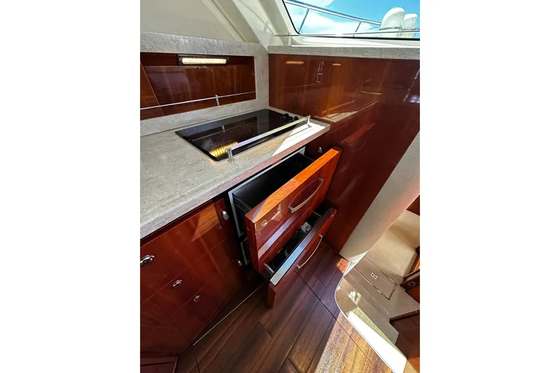  Yacht Photos Pics Luxurious kitchen area in 2012 Riviera 43 Flybridge yacht with modern appliances.
