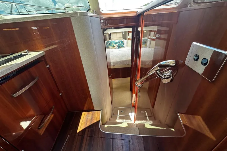  Yacht Photos Pics Interior view of 2012 Riviera 43 Flybridge yacht, featuring polished wood and modern design.