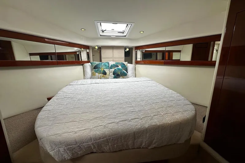  Yacht Photos Pics Luxurious bedroom interior of 2012 Riviera 43 Flybridge yacht with elegant bedding.