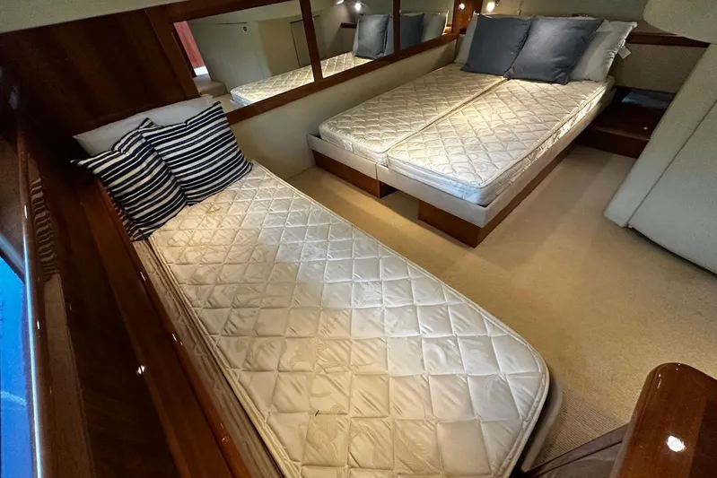  Yacht Photos Pics Luxurious cabin interior of 2012 Riviera 43 Flybridge yacht with twin beds.