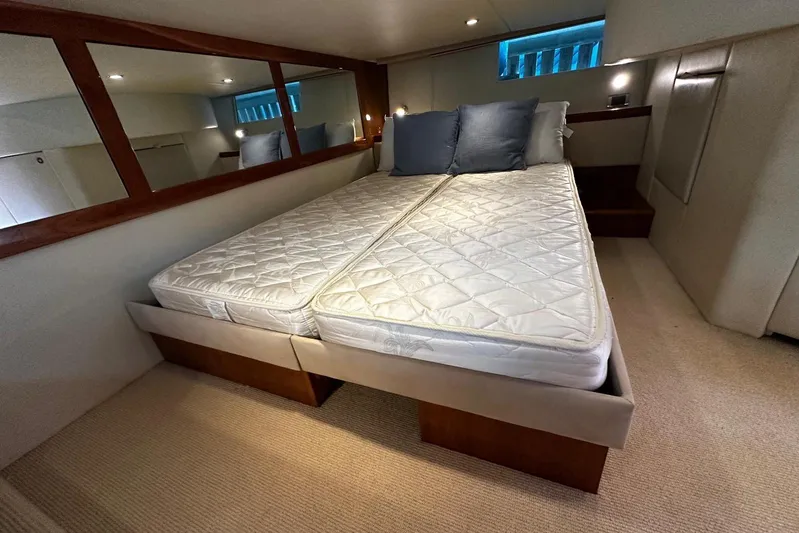  Yacht Photos Pics Luxurious bedroom interior of 2012 Riviera 43 Flybridge yacht with comfortable bedding.