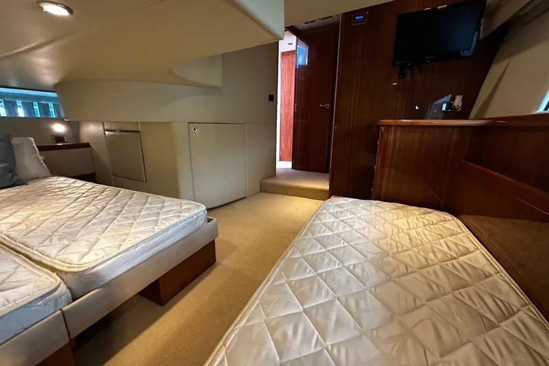  Yacht Photos Pics Interior of 2012 Riviera 43 Flybridge yacht with twin beds and modern amenities.