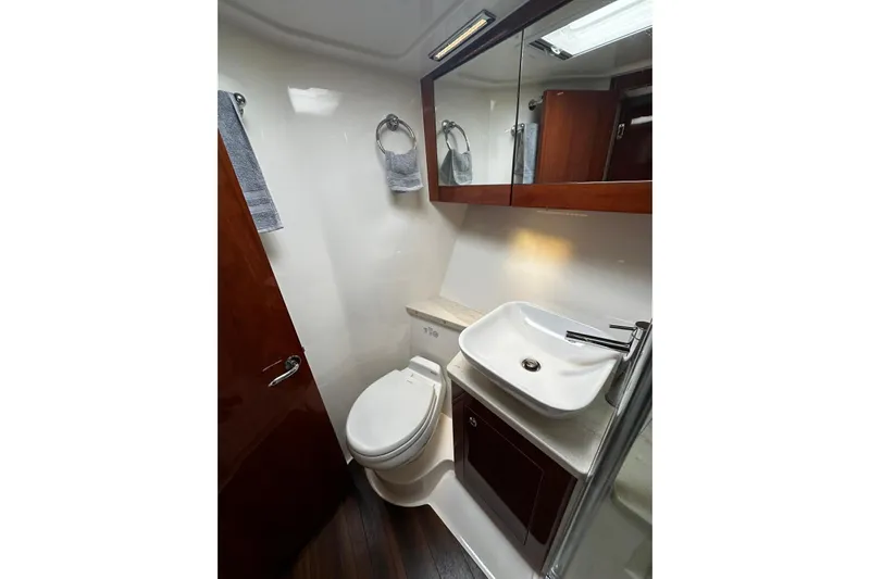 Yacht Photos Pics Luxurious bathroom in 2012 Riviera 43 Flybridge yacht with modern fixtures and elegant design.