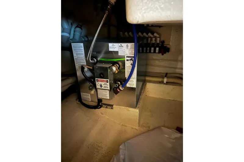  Yacht Photos Pics Engine room of 2012 Riviera 43 Flybridge yacht, featuring mechanical equipment and wiring.