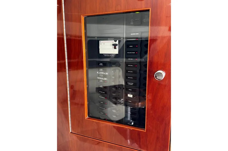  Yacht Photos Pics Electrical panel on 2012 Riviera 43 Flybridge yacht with wooden finish.