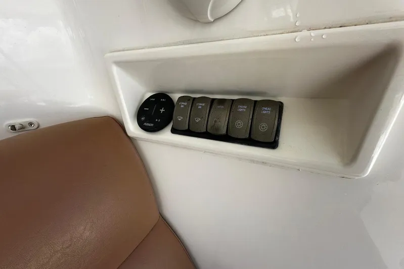  Yacht Photos Pics Control panel on 2012 Riviera 43 Flybridge with buttons and leather seating.