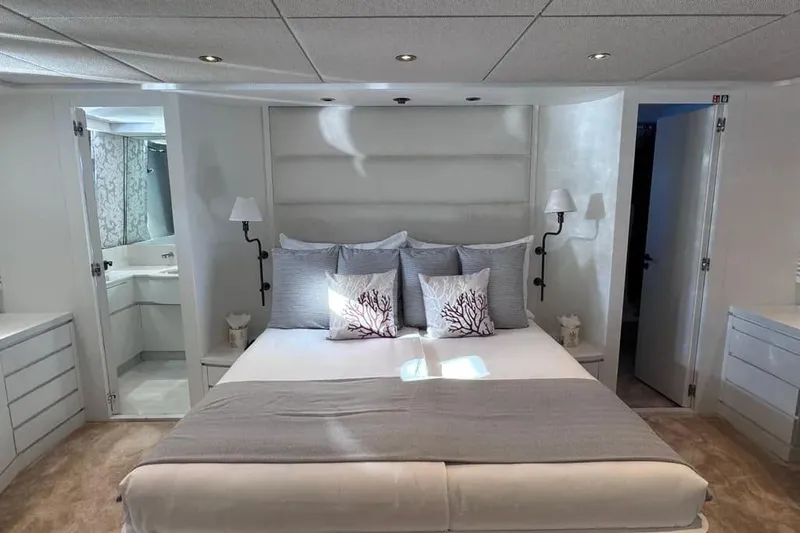  Yacht Photos Pics Luxurious bedroom on 2000 Sanlorenzo SL88 yacht with elegant decor and modern amenities.