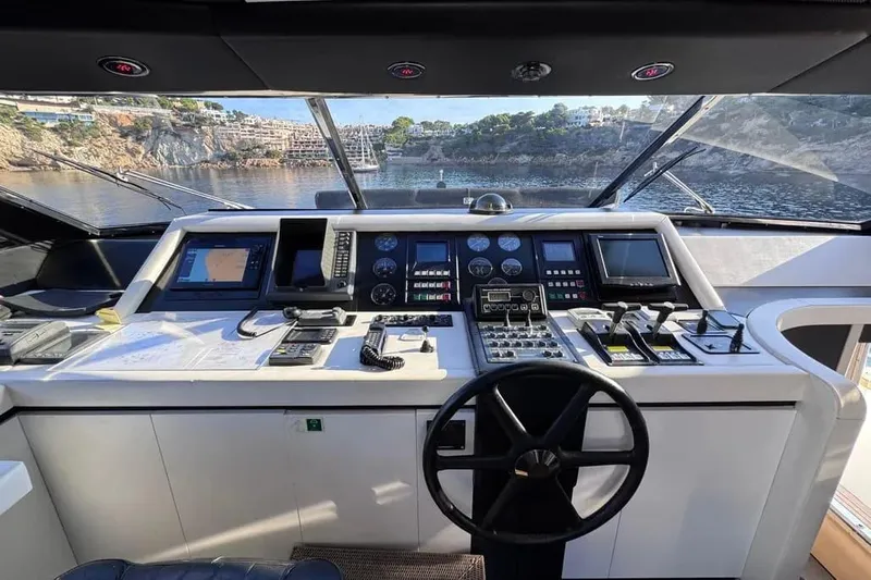  Yacht Photos Pics Cockpit of 2000 Sanlorenzo SL88 yacht with navigation controls and scenic ocean view.