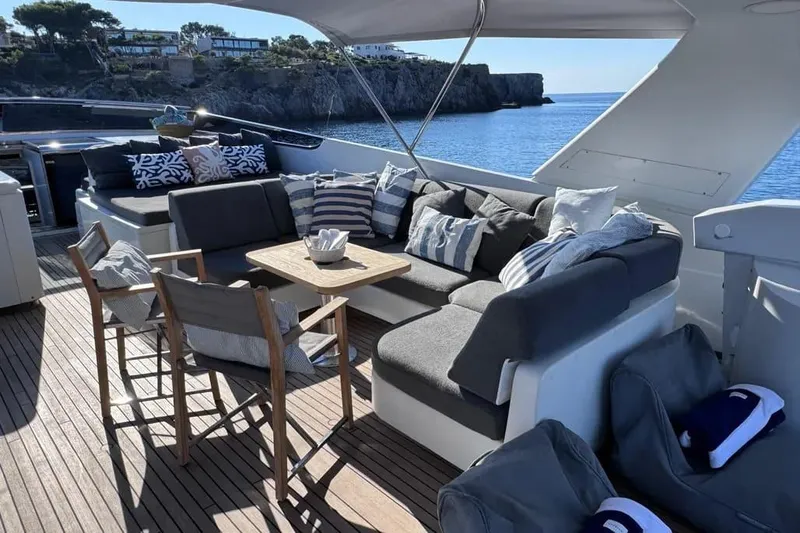  Yacht Photos Pics Luxurious Sanlorenzo SL88 yacht deck with elegant seating, cushions, and ocean view.