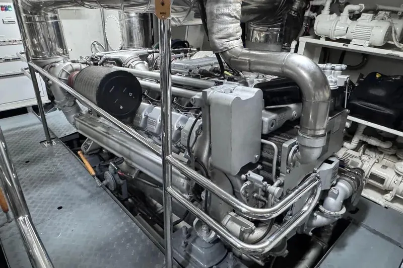  Yacht Photos Pics Engine room of 2000 Sanlorenzo SL88 yacht, showcasing complex machinery and piping.