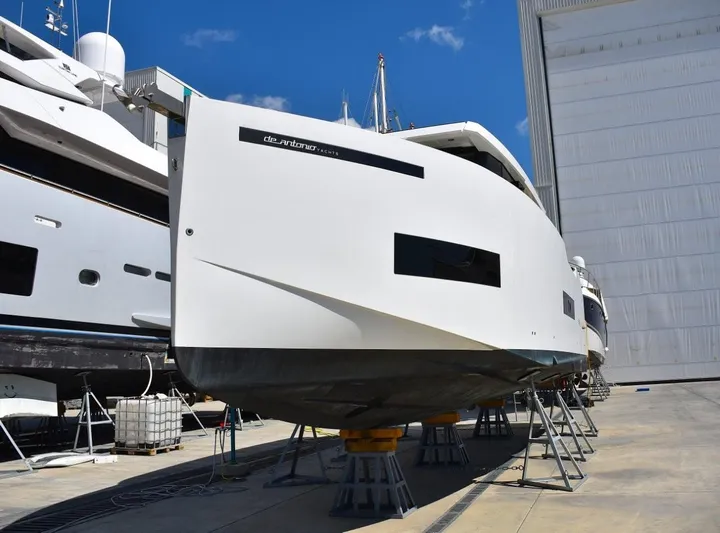  Yacht Photos Pics 2024 De Antonio Yachts D50 on dry dock, showcasing sleek design and modern features.