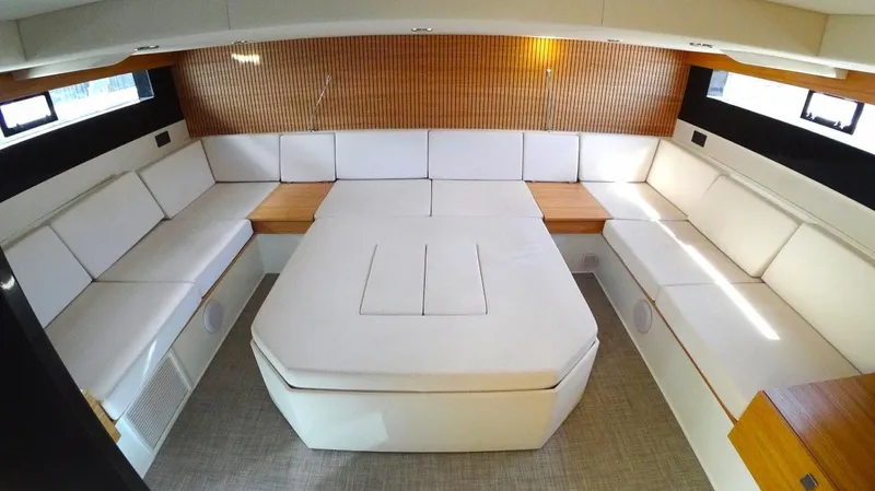  Yacht Photos Pics Luxurious interior of 2024 De Antonio Yachts D50 with white seating and wood accents.