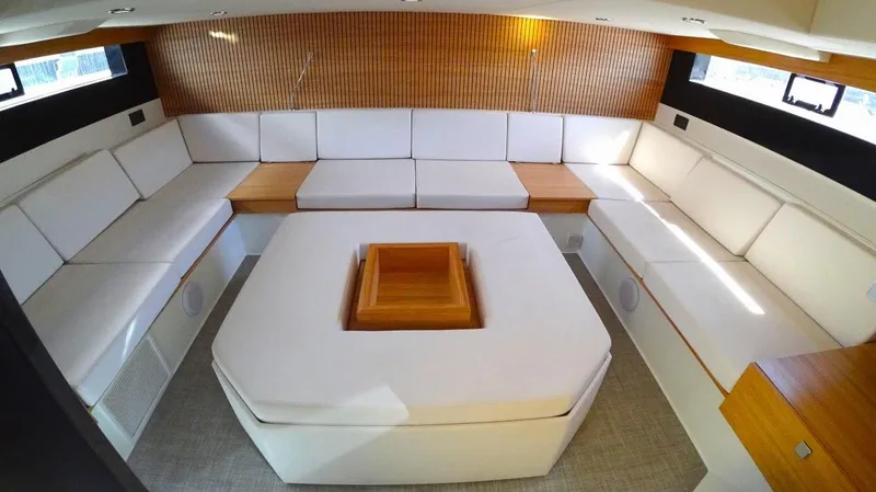  Yacht Photos Pics Luxurious interior of 2024 De Antonio Yachts D50 with elegant white seating and wooden accents.