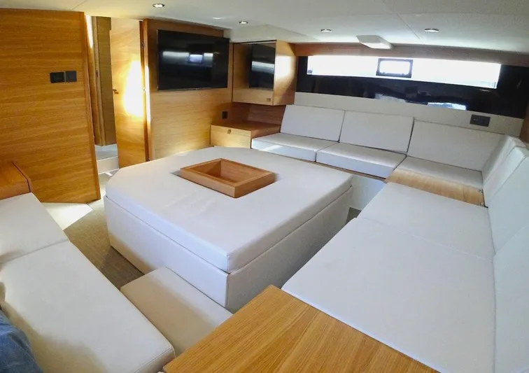  Yacht Photos Pics Luxurious interior of 2024 De Antonio Yachts D50 with modern seating and wooden accents.