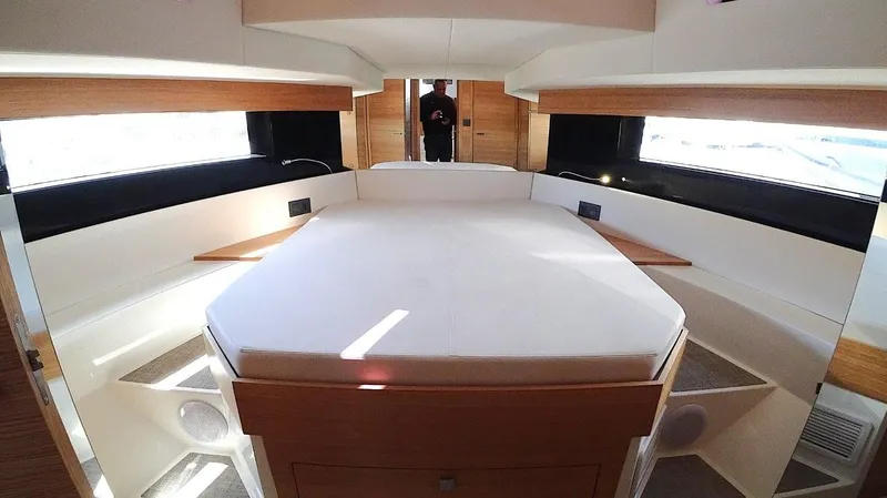  Yacht Photos Pics Luxurious interior cabin of 2024 De Antonio Yachts D50, featuring a spacious bed and modern design.