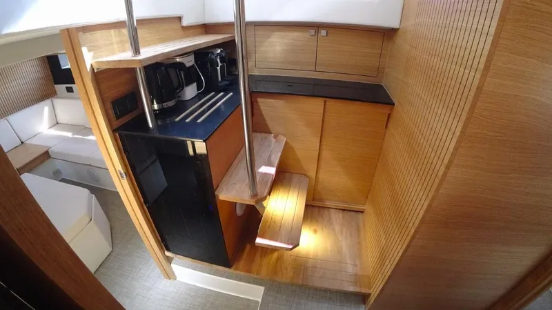 Yacht Photos Pics 2024 De Antonio Yachts D50 interior with modern kitchen and wooden finishes.