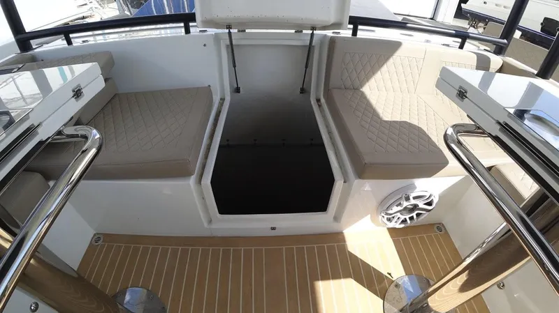  Yacht Photos Pics 2024 De Antonio Yachts D50 interior with beige seating and wood flooring.