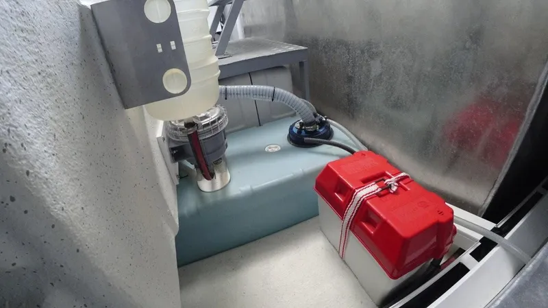  Yacht Photos Pics 2024 De Antonio Yachts D50 engine compartment with battery and fuel system components.