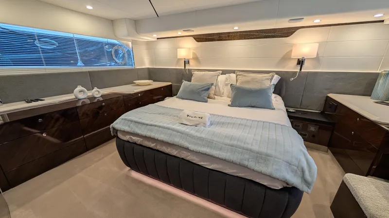 New 2025 Model Yacht Photos Pics Luxurious bedroom interior of 2025 Fairline Squadron 58 yacht, featuring elegant design and modern amenities.