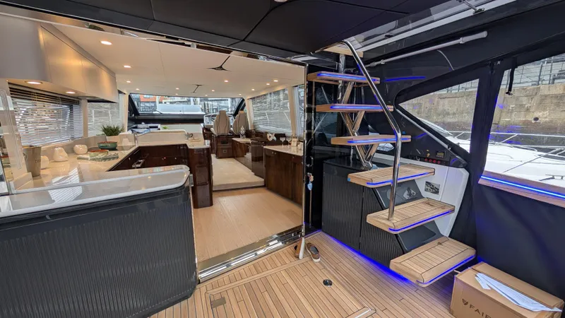 New 2025 Model Yacht Photos Pics Luxurious interior of 2025 Fairline Squadron 58 yacht with modern design and elegant staircase.