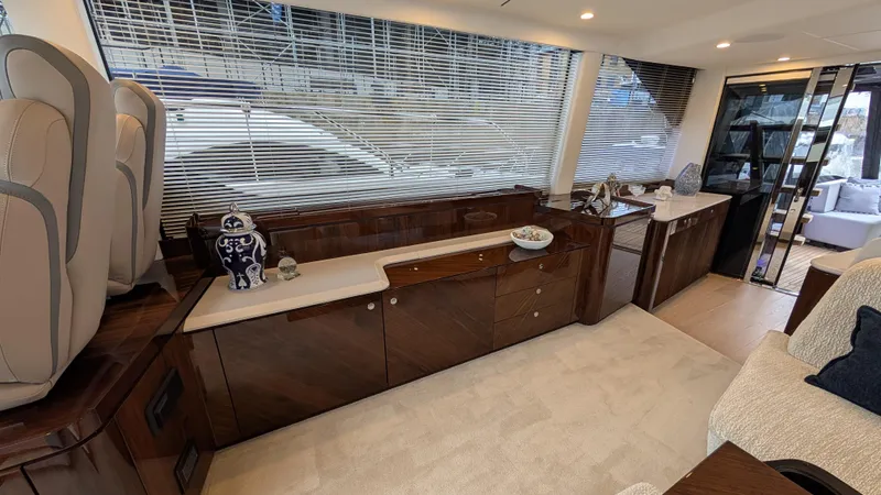 New 2025 Model Yacht Photos Pics Luxurious interior of 2025 Fairline Squadron 58 yacht with elegant wood finishes and modern decor.