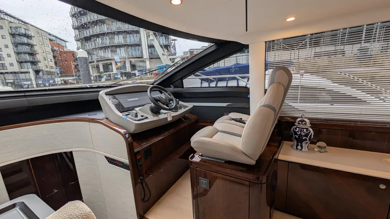 New 2025 Model Yacht Photos Pics Interior of 2025 Fairline Squadron 58 yacht with modern helm and luxurious seating.