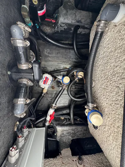  Yacht Photos Pics 2019 Yellowfin 24 Bay CE boat plumbing system with hoses and connectors.