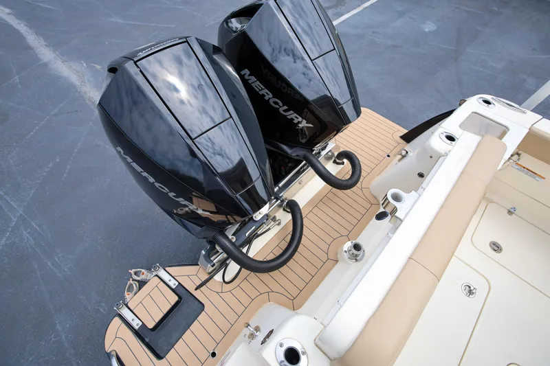  Yacht Photos Pics 2022 Scout 277 Dorado boat with dual Mercury outboard engines on deck.