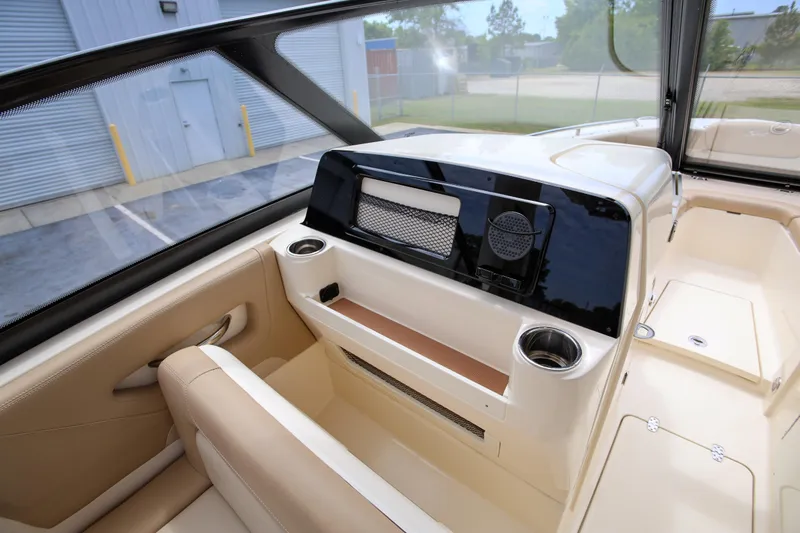  Yacht Photos Pics Interior view of 2022 Scout 277 Dorado boat, featuring seating and storage compartments.