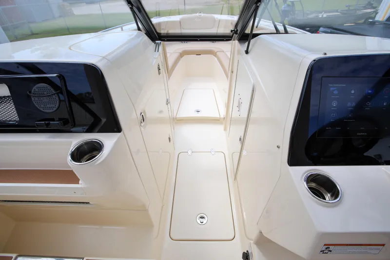  Yacht Photos Pics 2022 Scout 277 Dorado boat interior with modern dashboard and cup holders.