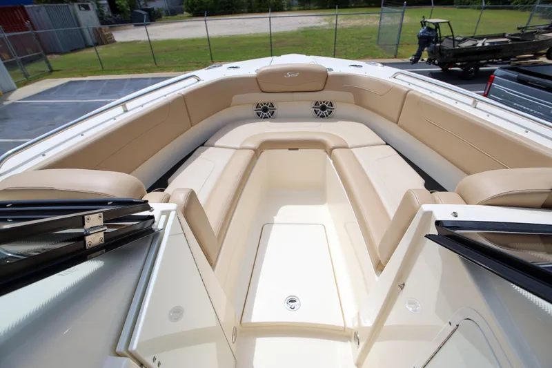 Yacht Photos Pics 2022 Scout 277 Dorado boat interior with beige seating and spacious layout.