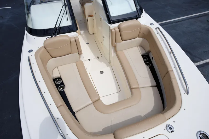 Yacht Photos Pics 2022 Scout 277 Dorado boat with luxurious beige seating and cup holders.