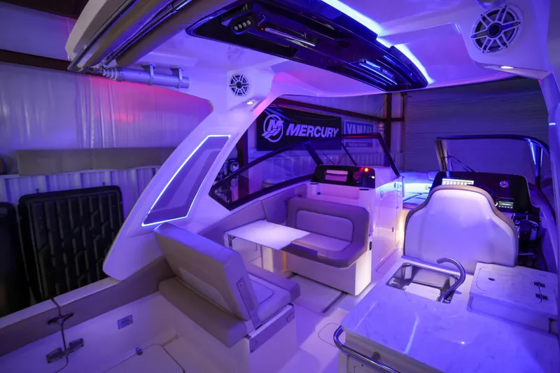  Yacht Photos Pics 2022 Scout 277 Dorado boat interior with modern lighting and seating arrangement.