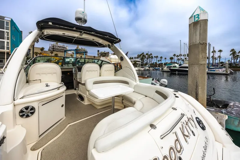 Good Kitty Yacht Photos Pics 2006 Sea Ray 340 Sundancer yacht docked at marina, featuring spacious seating and sleek design.