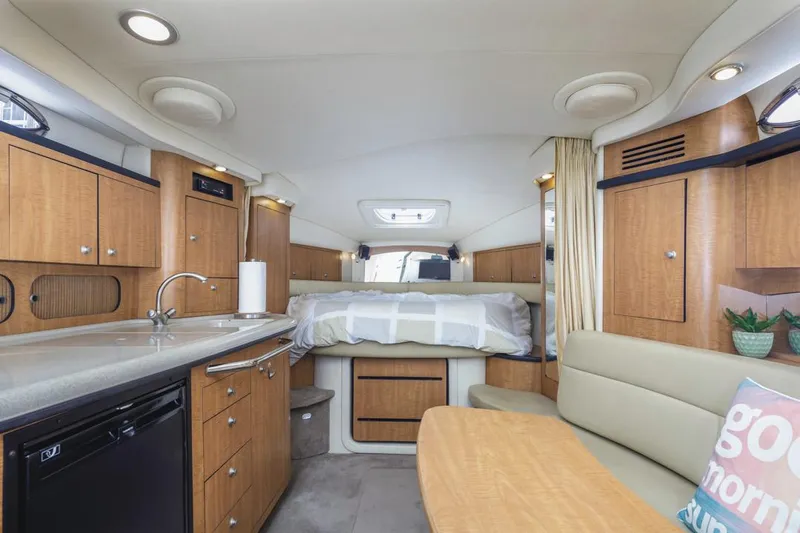 Good Kitty Yacht Photos Pics Interior of 2006 Sea Ray 340 Sundancer yacht with modern kitchen and cozy sleeping area.
