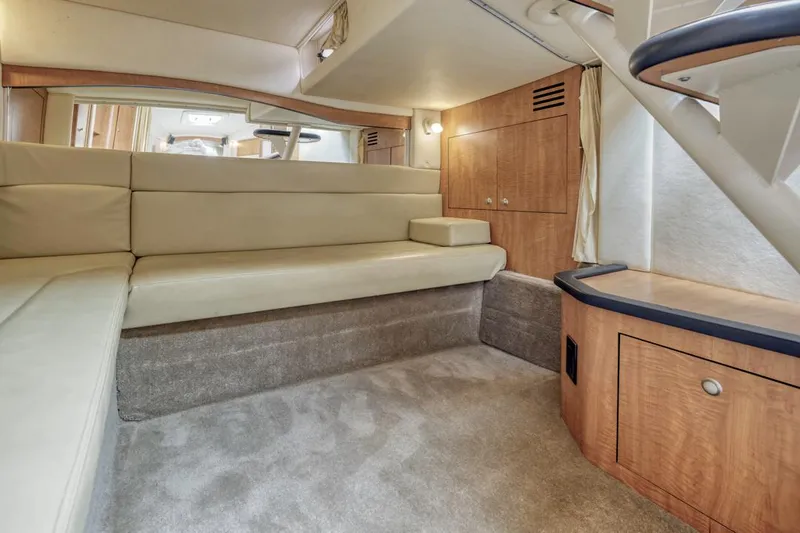 Good Kitty Yacht Photos Pics Interior of 2006 Sea Ray 340 Sundancer yacht with beige seating and wooden cabinetry.