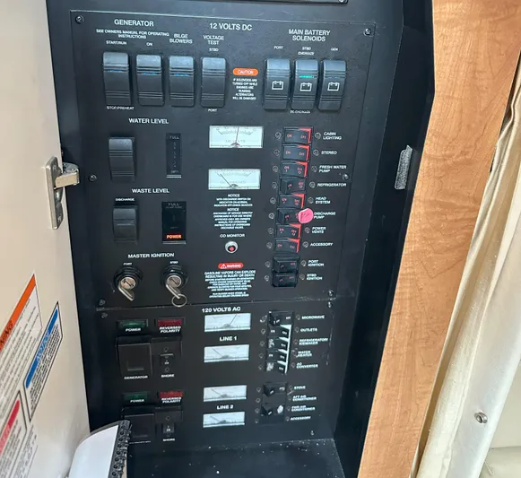 Good Kitty Yacht Photos Pics Control panel of a 2006 Sea Ray 340 Sundancer boat, showing various switches and gauges.