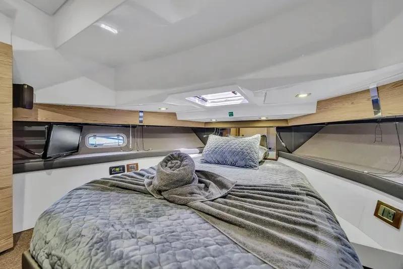  Yacht Photos Pics Luxurious cabin interior of 2020 Azimut Verve 40 yacht with plush bedding.