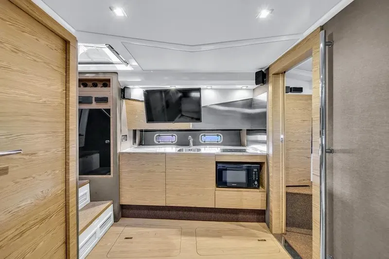  Yacht Photos Pics Modern interior of 2020 Azimut Verve 40 yacht with sleek kitchen and wood finishes.