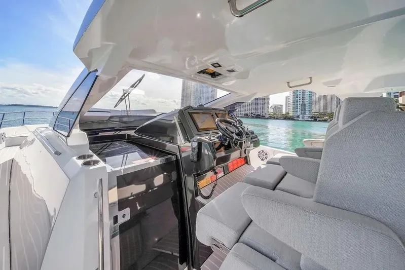  Yacht Photos Pics 2020 Azimut Verve 40 yacht interior with modern helm and waterfront view.