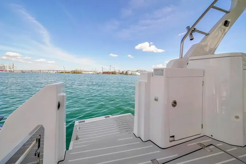  Yacht Photos Pics Azimut Verve 40 yacht deck, 2020 model, overlooking serene blue waters and cityscape.