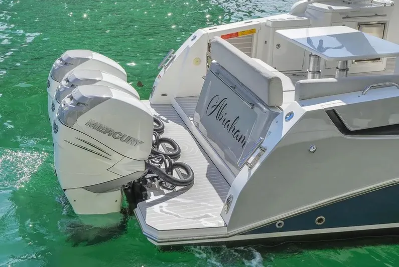  Yacht Photos Pics Azimut Verve 40 yacht, 2020 model, with triple Mercury outboard engines on turquoise water.