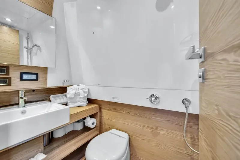 Yacht Photos Pics Modern bathroom interior on 2020 Azimut Verve 40 yacht, featuring sleek design and wood accents.