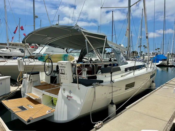 Kemosabe Yacht Photos Pics 2021 Jeanneau Sun Odyssey 440 yacht docked at marina under clear blue sky.