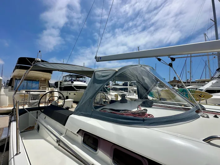 Kemosabe Yacht Photos Pics 2021 Jeanneau Sun Odyssey 440 sailboat docked at marina under blue sky.