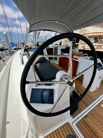Kemosabe Yacht Photos Pics Steering wheel of 2021 Jeanneau Sun Odyssey 440 sailboat, docked at marina.