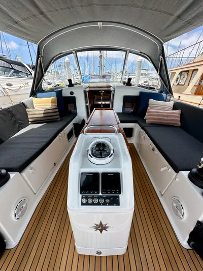 Kemosabe Yacht Photos Pics Interior of 2021 Jeanneau Sun Odyssey 440 sailboat with cushioned seating and navigation equipment.
